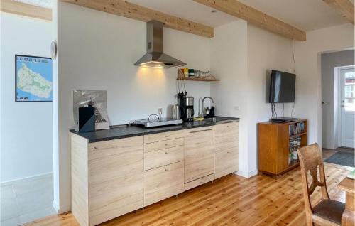 a kitchen with a counter top in a room at Nice Apartment In Østermarie With Wifi in Østermarie