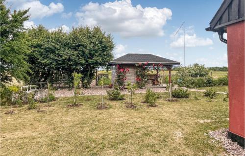 a garden with trees and plants in a building at Nice Apartment In Østermarie With Wifi in Østermarie