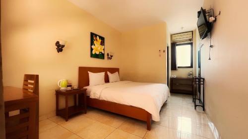 Ένα ή περισσότερα κρεβάτια σε δωμάτιο στο Centro Bajo Hotel & Resto
