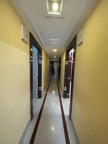 a hallway of an office building with a long corridor at ROOP AMRIT GUEST HOUSE in Agartala