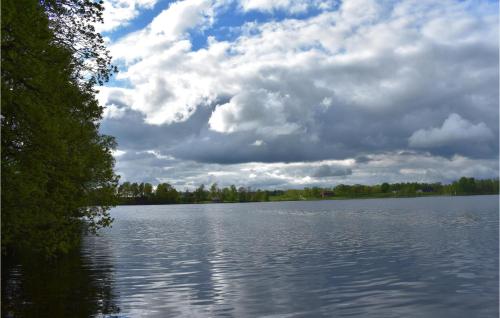 a view of a large lake with a cloudy sky at Awesome Home In Askome With Wifi in Askome