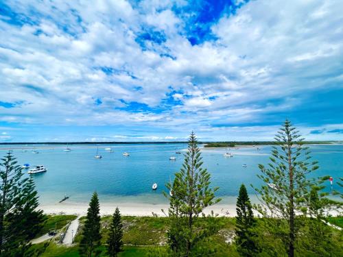 a view of a beach with boats in the water at Ocean View 2BR Apartment and SPA in Gold Coast