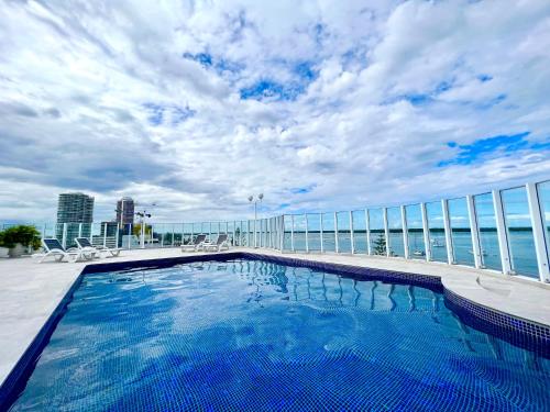 a swimming pool on the roof of a building at Ocean View 2BR Apartment and SPA in Gold Coast