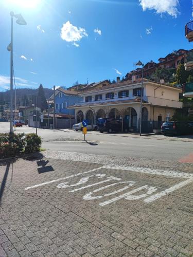 a stop sign on a street in a town at La Ginestra - between lake and mountains in Colazza