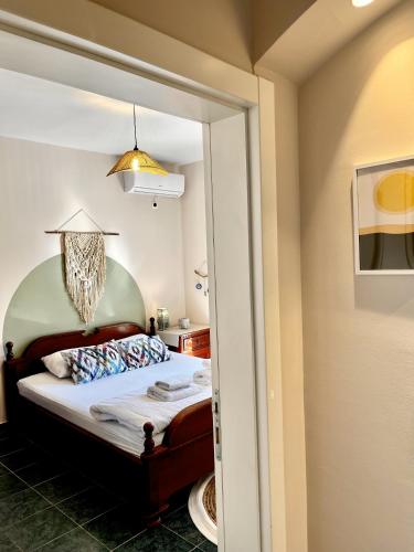 a bedroom with a bed and a mirror at Villa Merci Budva in Budva