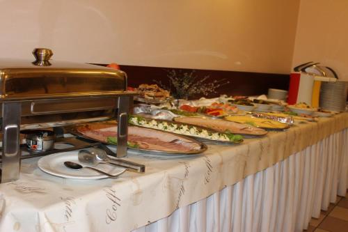 a buffet line with many different types of food at Hotel Relaks in Wola Ducka
