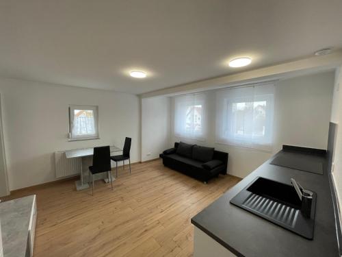 a living room with a couch and a table at Das Haus im Biosphärengebiet Schwäbische Alb in Dornstadt