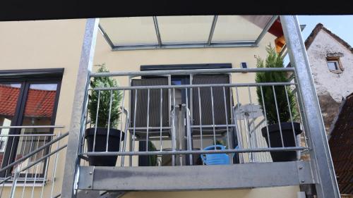 a balcony with bars on a building at Toskana in Klingenmünster