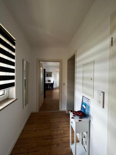 a room with a desk with a laptop on a table at Ferienwohnung Coburger Land, ländlich gut gelegen in Meeder