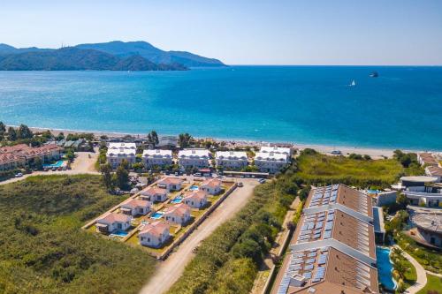 an aerial view of a resort next to the ocean at SunTeos Villa Suites in Fethiye