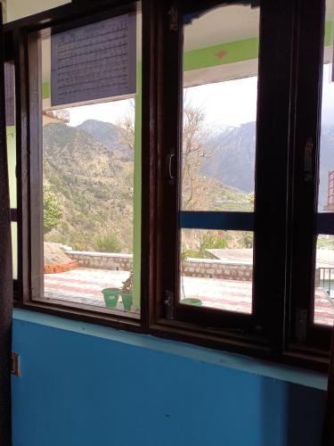 a window with a view of a mountain view at Kareri Wayfarer in Kareri