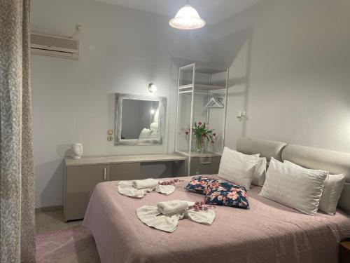 Postel nebo postele na pokoji v ubytování Hotel Karagianni