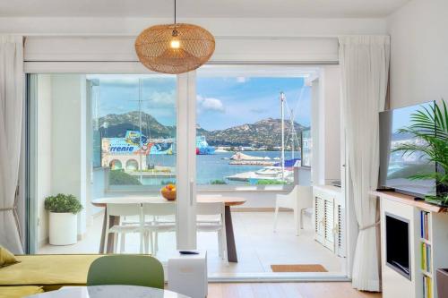 a living room with a view of the water at Olbia Luxury Apartment in Olbia