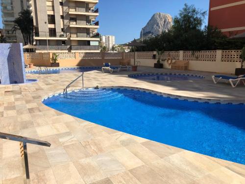 a swimming pool in the middle of a building at Amatista 11 a in Calpe