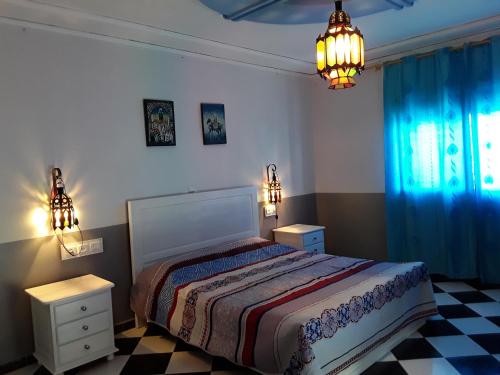 Postel nebo postele na pokoji v ubytování Maison d'Hôte à Saïdia