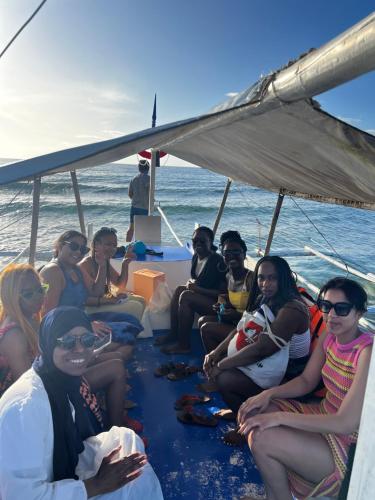 a group of people sitting on the back of a boat at Bohol Island Homestay in Dauis