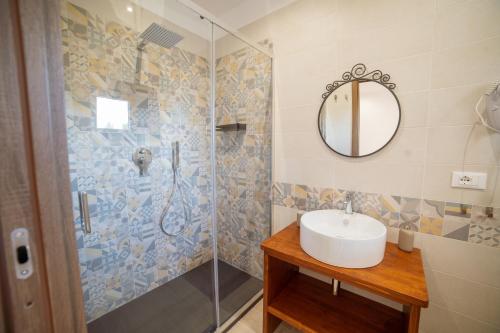 a bathroom with a sink and a shower at B&B Belvedere in Ischitella
