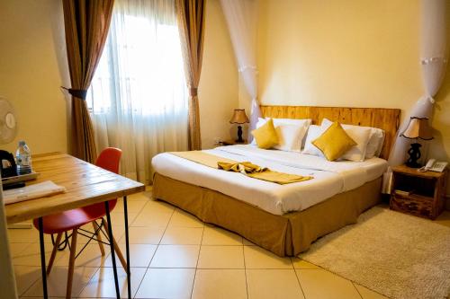 Ένα ή περισσότερα κρεβάτια σε δωμάτιο στο Acacia Hotel Mbarara