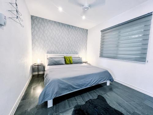 מיטה או מיטות בחדר ב-Visaya Pearl