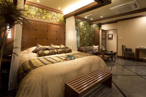 Кровать или кровати в номере Hotel and Spa Lotus Modern (Adult Only)