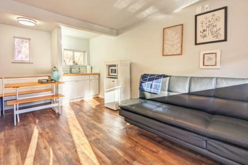 a living room with a couch and a table at The Fountain Creek Inn of Manitou Springs in Manitou Springs