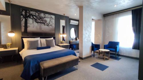 Ένα ή περισσότερα κρεβάτια σε δωμάτιο στο Skopea Inn Exclusive Hotel