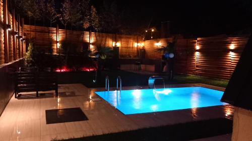 a swimming pool in a backyard at night at palace_sapanca in Sapanca