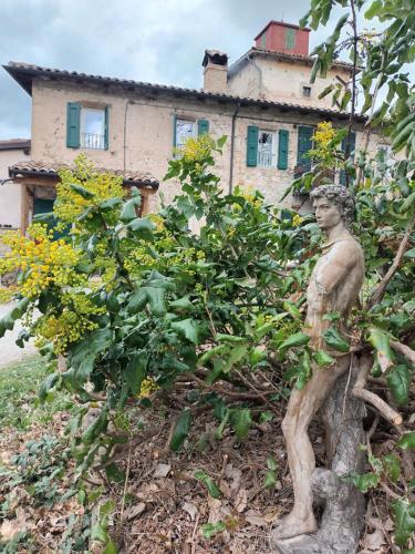 a statue of a man in front of a house at Ca' Morano in Pavullo nel Frignano