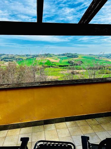 a view of a field from a window at Villetta verde Smeraldo in Vignale Monferrato