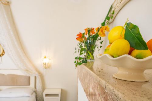 a bowl of fruit sitting on a counter at Villa Giannina B&B in Taormina