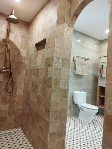 a bathroom with a toilet and a shower at Modern luxury villa Paradise in Calpe