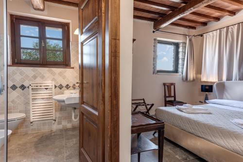 Relais Le Ginestreにあるベッド