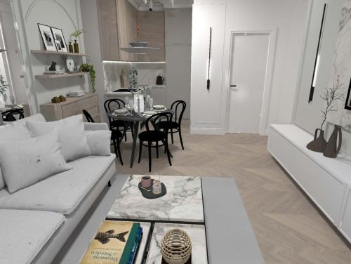 sala de estar con sofá blanco y mesa en Apartament Lux Sopot Monte Cassino, en Sopot