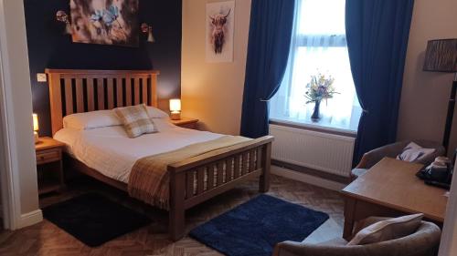 Un ou plusieurs lits dans un hébergement de l'établissement The Renishaw Rooms