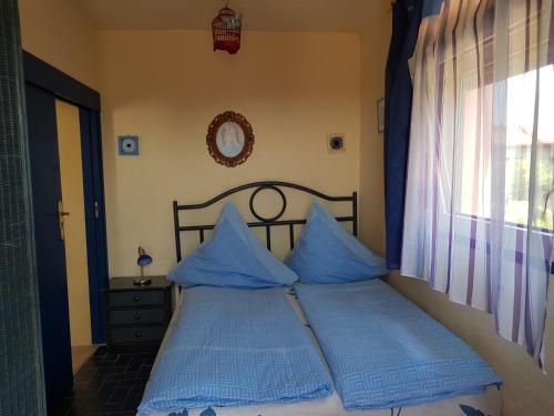 Postel nebo postele na pokoji v ubytování Villa Casa rosa Maria