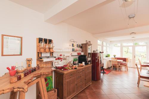 a kitchen with wooden cabinets and a counter top at Kleinhofers Himbeernest in Anger