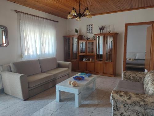 a living room with a couch and a table at ANASA in Stavros