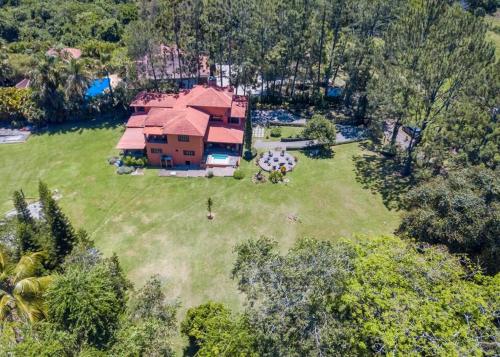 an aerial view of a house with a large yard at Escape Chalet at Pinar del Sol in Jarabacoa in Jarabacoa