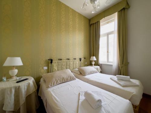Ένα ή περισσότερα κρεβάτια σε δωμάτιο στο Trieste Luca's Home