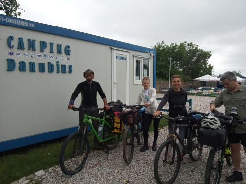 a group of people with their bikes in front of a trailer at Camping Danubius Tulcea in Tulcea