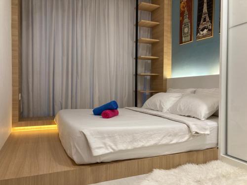 Ένα ή περισσότερα κρεβάτια σε δωμάτιο στο Straits Garden Suite Jelutong Georgetown