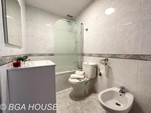 a bathroom with a toilet and a sink and a shower at Bga Rentals Aini in Cambrils