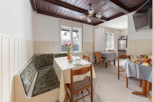 a living room with a couch and a table at Vrtnarjeva hiša, The Gardener's Cottage in Radovljica