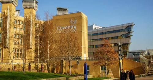 a building with a university sign on the side of it at Stylish Town House - Modern double room - 1 in Parkside