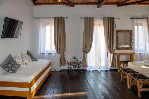 Ένα ή περισσότερα κρεβάτια σε δωμάτιο στο Lemnos grand maison