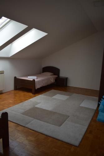 a bedroom with a bed and a large rug at Wellcome to Sarajevo in Sarajevo