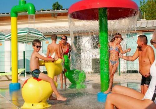 a group of people playing in a water park at Mobile home in Boofzheim