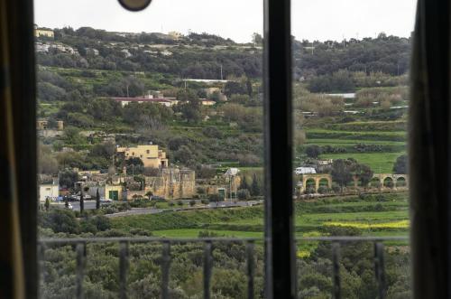 a view of a city from a window at Xemxija Bay Hotel in St Paul's Bay