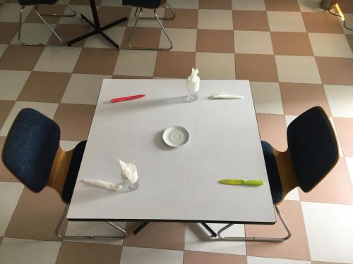 a white table with a cat sitting on top of it at Residence MaryHouse - Free Breakfast and Taxi From Airport in Cotonou