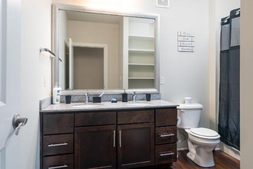 a bathroom with a sink and a mirror at Stylish 1BR in at the Crossing in Indianapolis